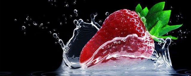 Strawberry splashing into water